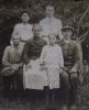 Стоят: Николай (слева) и Григорий (он также умер в 33-м). 
Сидят, слева-направо:  Иван, Агафья Марковна, Раиса, Василий Акимович.